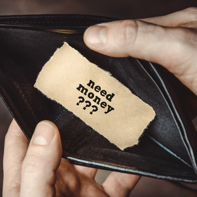 an empty wallet with a note