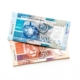 A one hundred ZAR note laying on top of a fifty Rand note