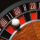 Landed ball in number 11 slot of roulette wheel