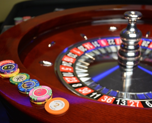roulette wheel with casino chips placed on the edges