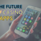 The future of casino apps text with hand holding iPhone