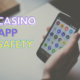 Casino app safety text with hand holding iPhone