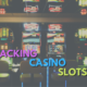 Hacking Casino Slots text with row of slot machines