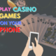 play casino games on your phone text with playing cards background